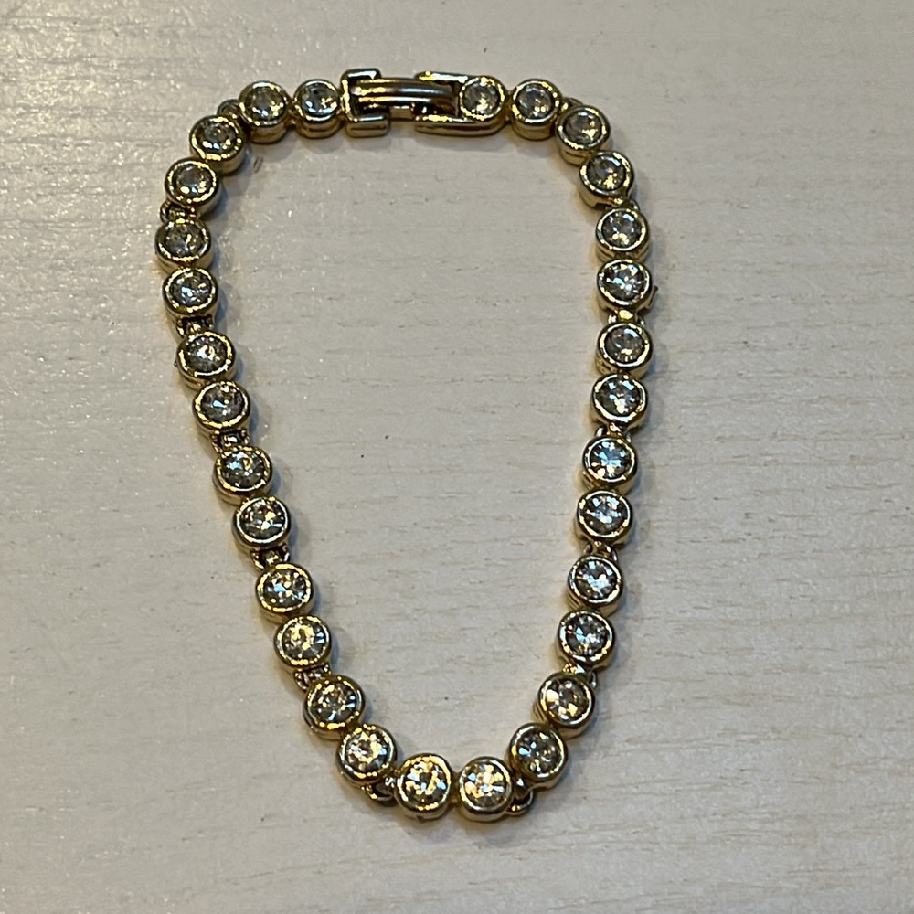 PRICE DROP. ..Beautiful and gold and diamond like bracelet. Just beautiful.